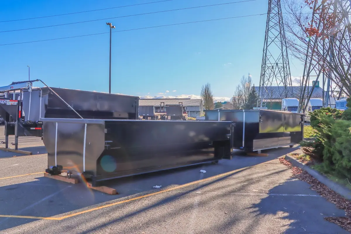 Roll-off dumpster ready for waste disposal at job site for 2 Yard Dumpster Rental in Forest